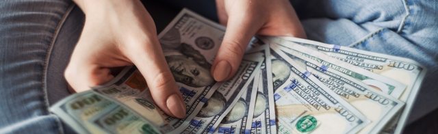 Person holding cash