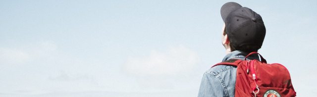 A student looking up into the sky