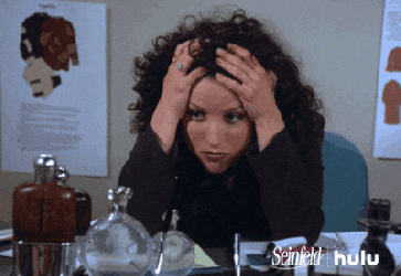 Julia Louis Dreyfus in Seinfeld looking stressed
